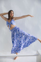 Model wearing our Agus Skirt, maxi with floral print and matching top.