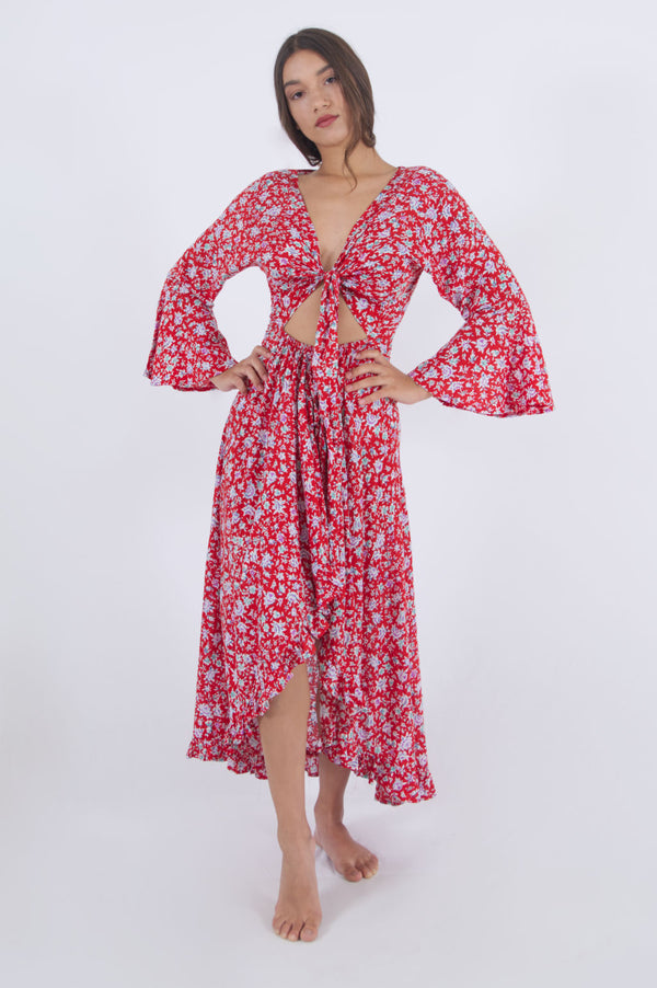 Our Paola long summer dress with bell sleeves in red floral pattern.