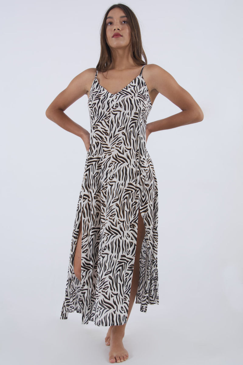 Our Madonna animal print dress, maxi with spaghetti straps and side splits.