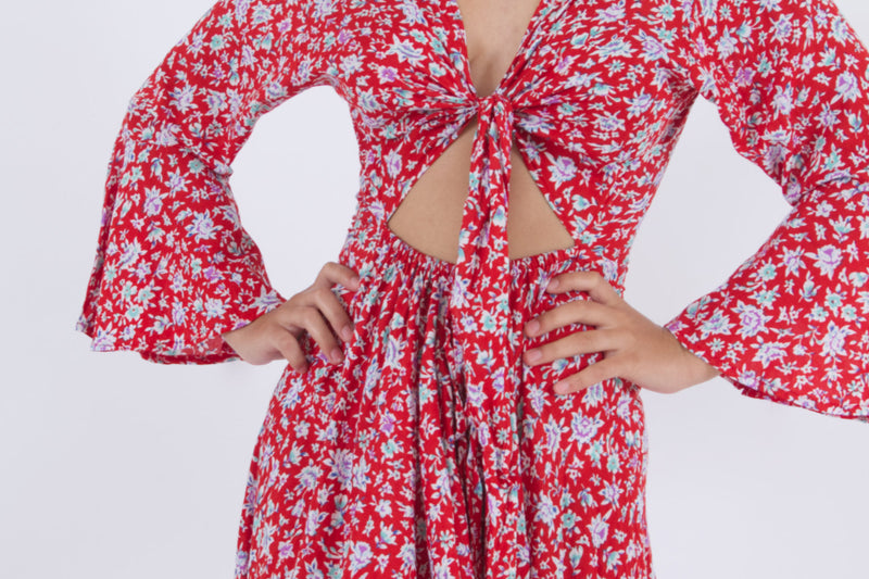 Detail of crop top dress that ties in front. A summer garment in red floral pattern with kecil flowers.