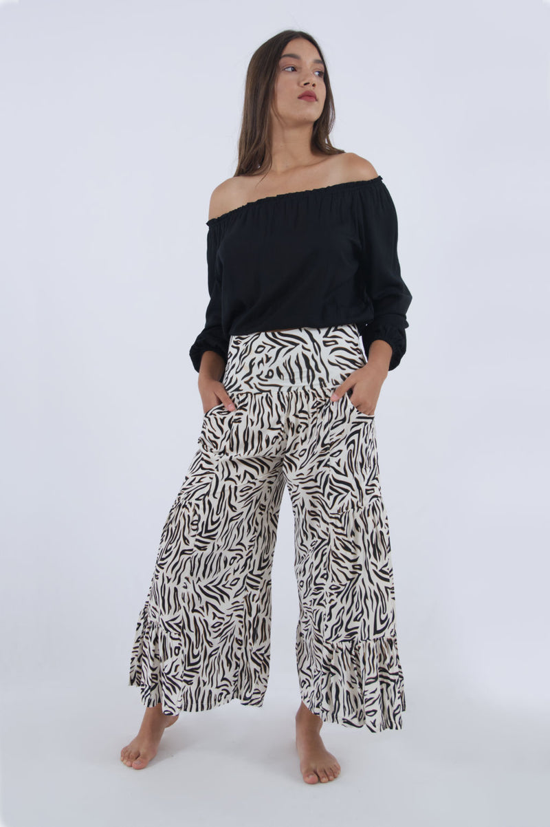 Photo of our Gypsy elasticated waist trousers for women. Summer cropped trousers in black and white zebra print.