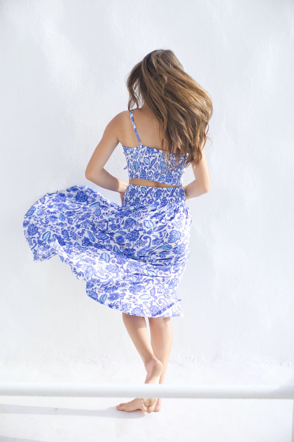 Light summer skirt with slit in blue floral print and matching top - back side