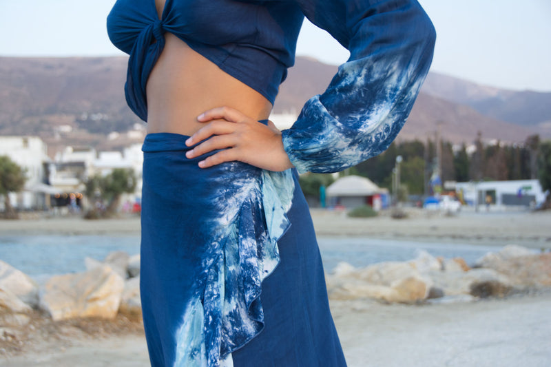 Long blue skirt wrap with tie dye frill.