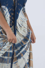Detail of our tie dye summer dress for women, in blue and cream shades.